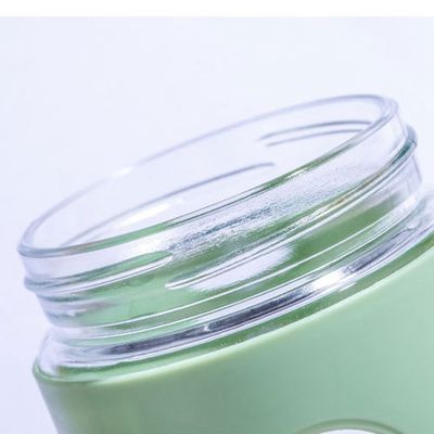 Office 500ml Custom Logo Bottiglia d'acqua in vetro con manica in plastica